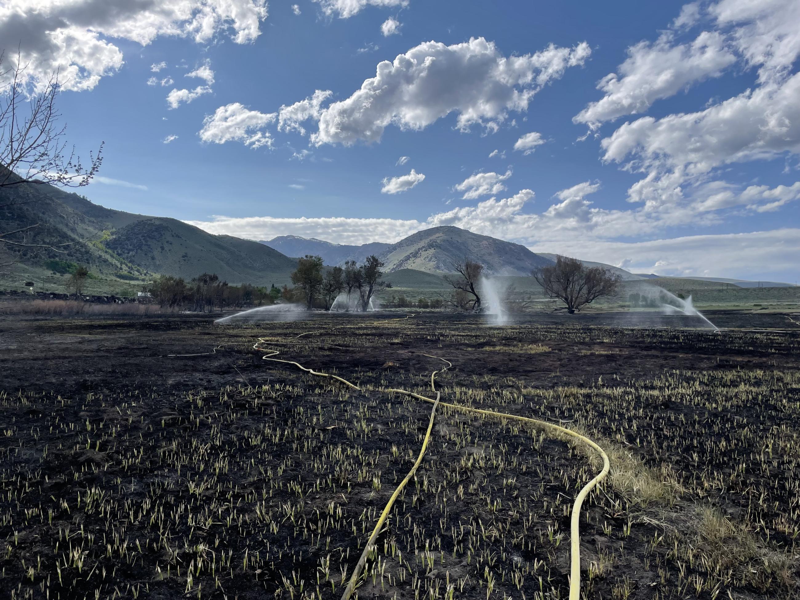 Sprinklers in the field on the Inn Fire