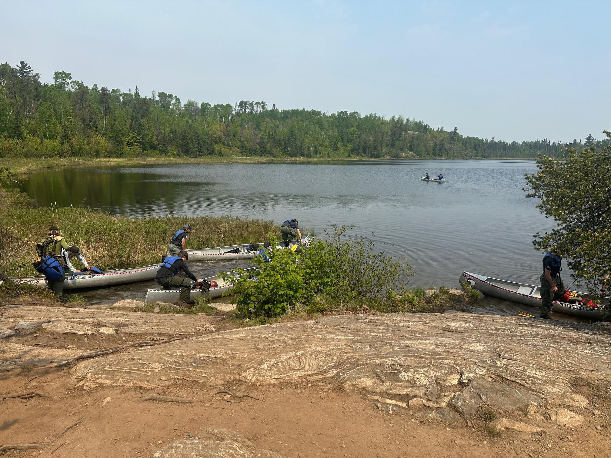 Crews at Mudro Lake canoe put-in heading in the Boundary Waters