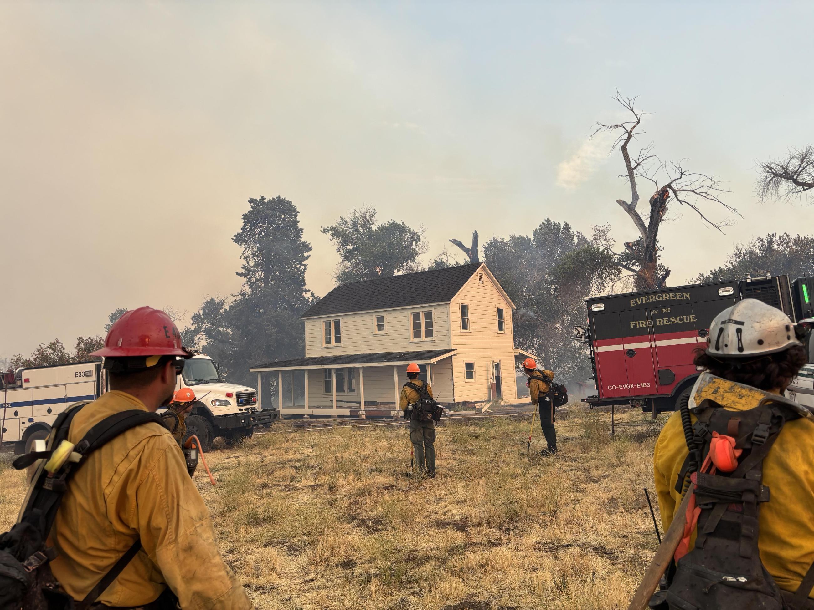 Fire Personnel performing structure protection - Madre Fire 