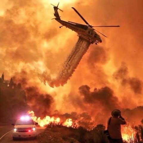 Helicopter over fire and smoke on Madre Fire at night