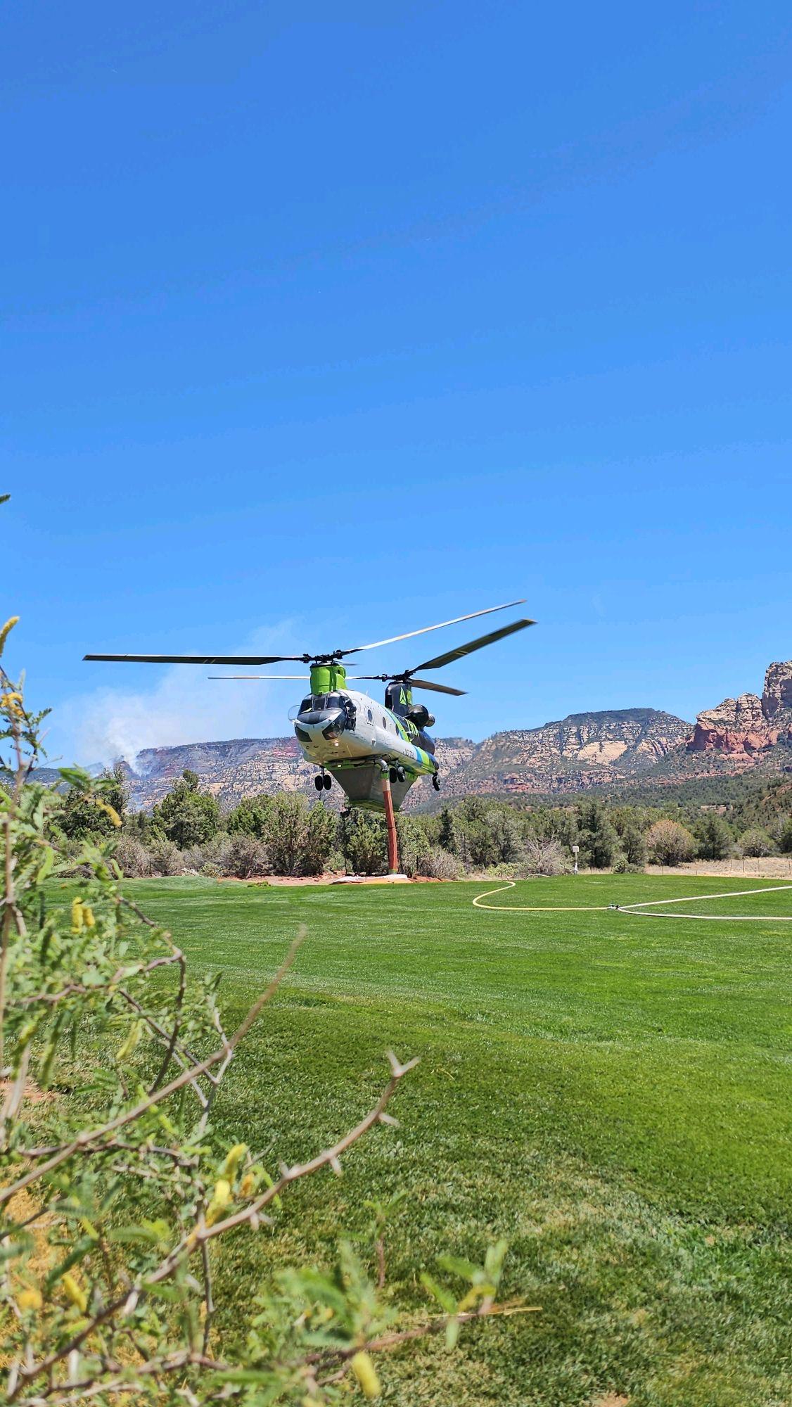 Helicopter Dips Water