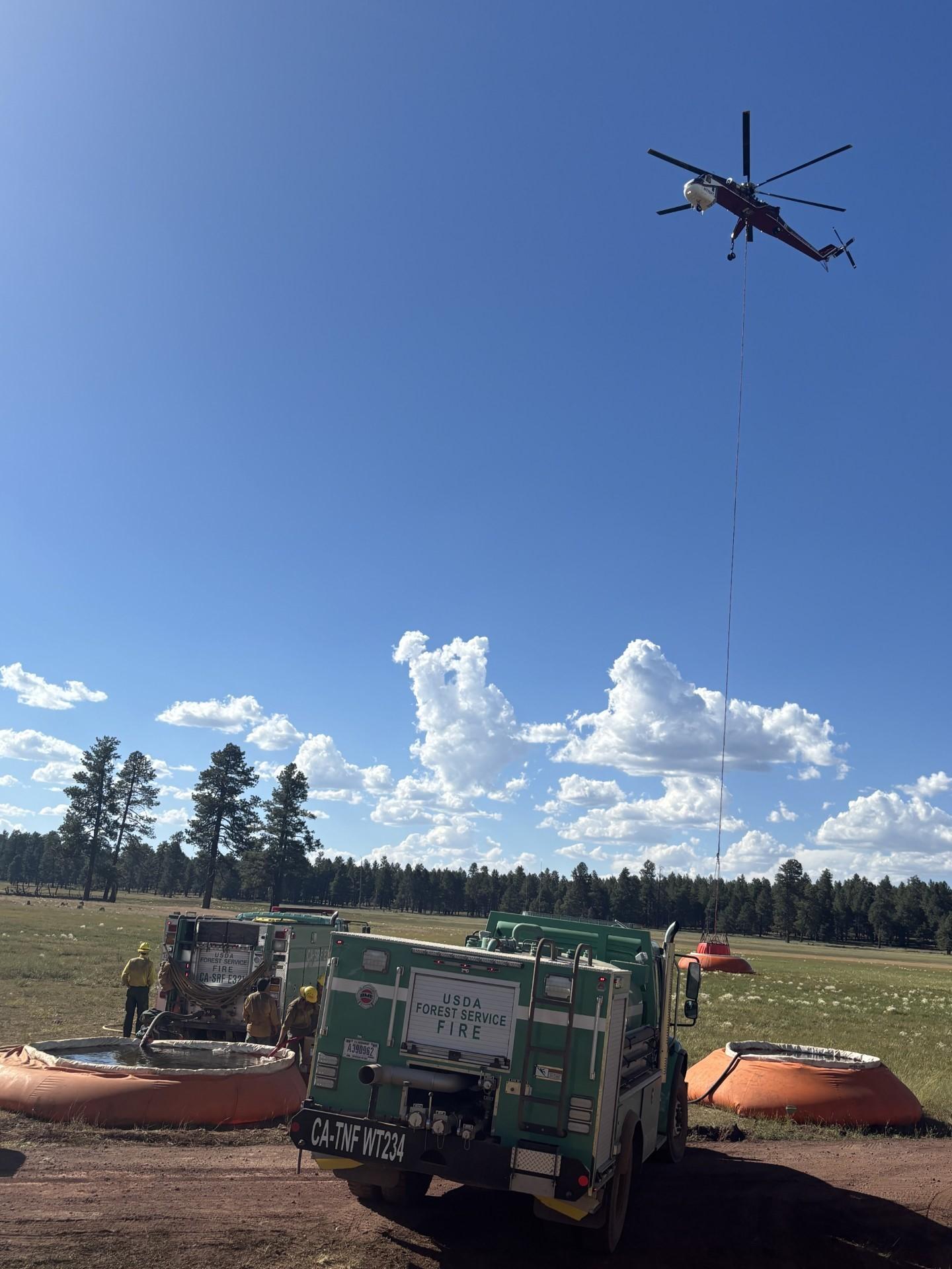 Firefighters Assisting Helicopter Crew Members